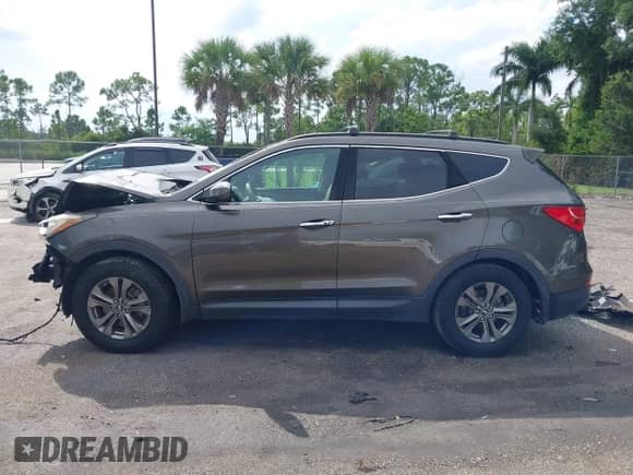 2014 Hyundai Santa Fe with VIN 5XYZU3LB0EG217513, listed as a IAAI auction lot 43183935 with Not provided miles and . Bid and sale history available at DreamBid. Image 13.