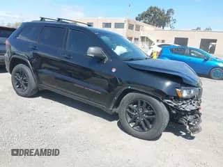 2020 Jeep Grand Cherokee Trailhawk with VIN 1C4RJFLG4LC118975, listed as a IAAI auction lot 41895950 with 106,638 mi miles and . Bid and sale history available at DreamBid. Image 1.