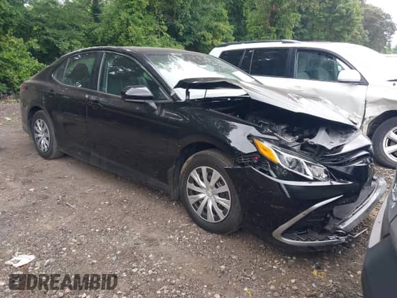 2022 Toyota Camry Hybrid LE with VIN 4T1C31AK3NU570645, listed as a IAAI auction lot 42659916 with 19,420 mi miles and . Bid and sale history available at DreamBid. Image 1.