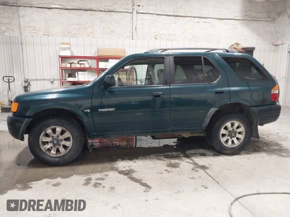1998 Honda Passport LX with VIN 4S6CM58W9W4419797, listed as a IAAI auction lot 42425697 with 158,562 mi miles and . Bid and sale history available at DreamBid. Image 14.