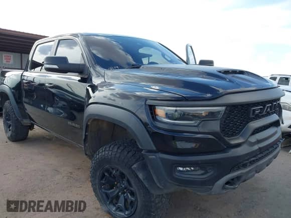 2022 Ram 1500 TRX with VIN 1C6SRFU90NN103186, listed as a IAAI auction lot 42888581 with 53,781 mi miles and . Bid and sale history available at DreamBid. Image 6.