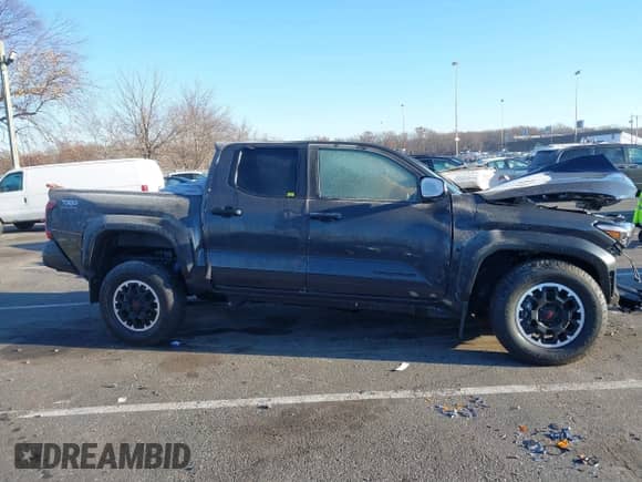 2024 Toyota Tacoma SR5 with VIN 3TMLB5JN3RM028853, listed as a IAAI auction lot 40990601 with 10,095 mi miles and . Bid and sale history available at DreamBid. Image 13.