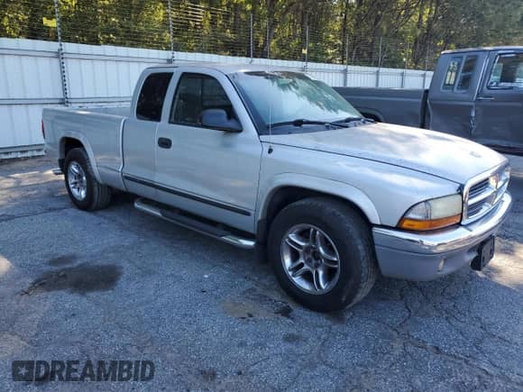 2004 Dodge Dakota SLT z VIN 1D7GL42N54S750919, wystawiony jako Copart lot #74625574 z przebiegiem 174 107 mil mil oraz Czysty tytuł • Clean title. Historia ofert i sprzedaży dostępna na DreamBid. Obrazek 4.
