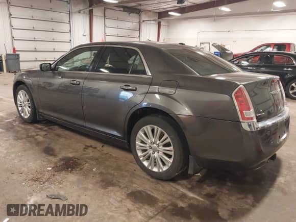 2013 Chrysler 300 with VIN 2C3CCARG6DH708382, listed as a IAAI auction lot 42999190 with 157,977 mi miles and . Bid and sale history available at DreamBid. Image 3.