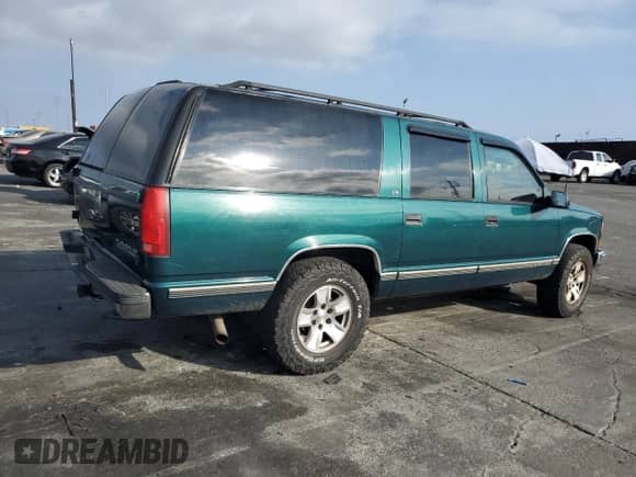 1997 Chevrolet Suburban with VIN 3GNFK16R4VG163602, listed as a Copart auction lot 76081984 with 243,169 mi miles and Salvage title. Bid and sale history available at DreamBid. Image 3.