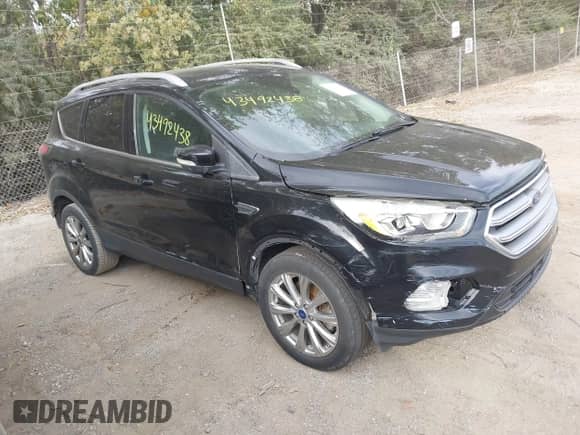 2017 Ford Escape Titanium z VIN 1FMCU9J90HUB07021, wystawiony jako IAAI lot #43492438 z przebiegiem 157 644 mil mil oraz . Historia ofert i sprzedaży dostępna na DreamBid. Obrazek 1.