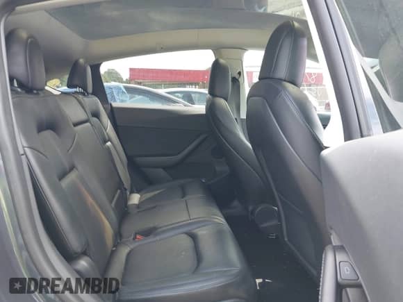 2021 Tesla Model Y Long Range with VIN 5YJYGAEE6MF251590, listed as a IAAI auction lot 43066576 with 33,937 mi miles and . Bid and sale history available at DreamBid. Image 8.