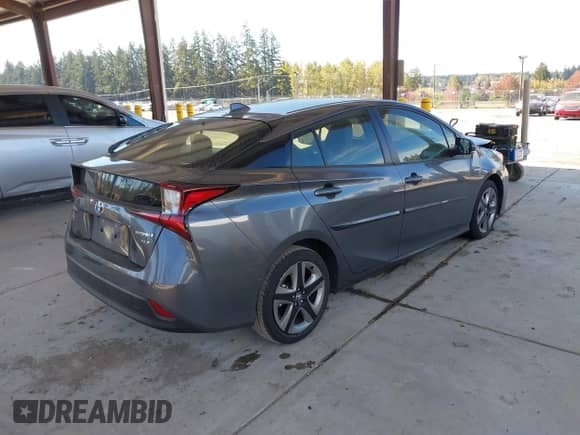 2022 Toyota Prius L Eco with VIN JTDKAMFUXN3155488, listed as a IAAI auction lot 43450434 with 39,407 mi miles and . Bid and sale history available at DreamBid. Image 4.