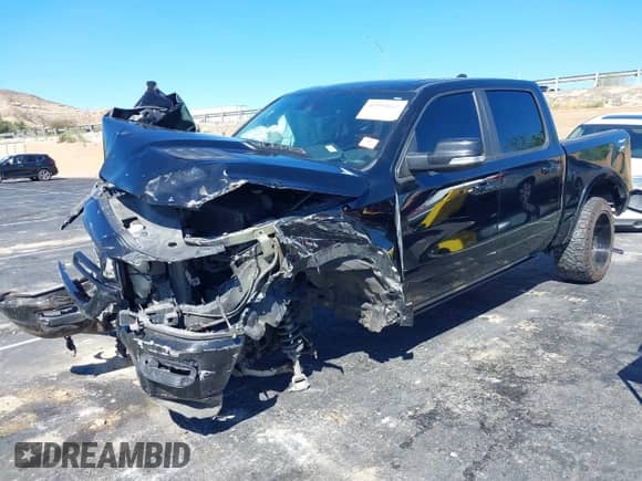 2021 Ram 1500 Laramie with VIN 1C6SRFJTXMN823383, listed as a IAAI auction lot 43353162 with 82,117 mi miles and . Bid and sale history available at DreamBid. Image 16.