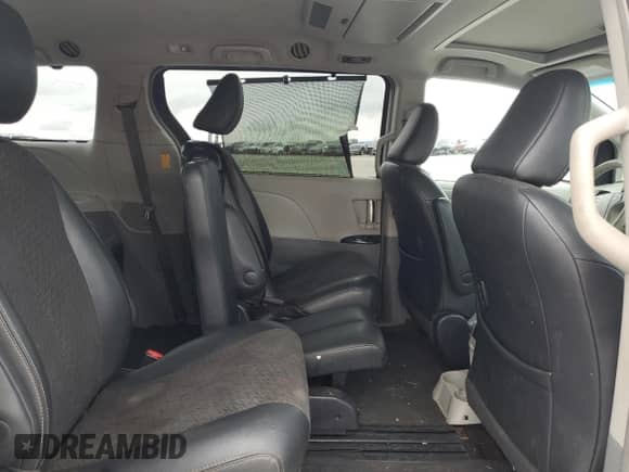 2014 Toyota Sienna SE with VIN 5TDXK3DCXES431576, listed as a Copart auction lot 69655795 with 221,877 mi miles and Salvage title. Bid and sale history available at DreamBid. Image 11.