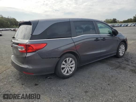 2018 Honda Odyssey LX with VIN 5FNRL6H29JB043696, listed as a Copart auction lot 80569835 with 29,515 mi miles and Salvage title. Bid and sale history available at DreamBid. Image 3.
