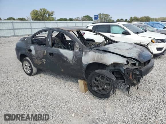 2002 Dodge Neon ES with VIN 1B3ES56C62D620069, listed as a Copart auction lot 77187524 with Not provided miles and Salvage title. Bid and sale history available at DreamBid. Image 4.