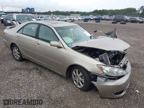 2005 Toyota Camry XLE with VIN 4T1BF30K55U106627, listed as a IAAI auction lot 43237399 with 216,571 mi miles and . Bid and sale history available at DreamBid. Image 1.