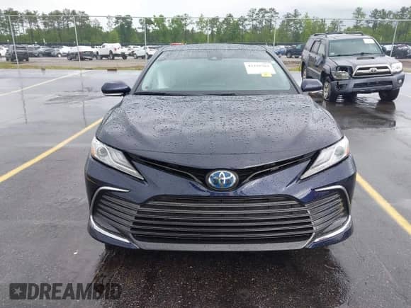 2021 Toyota Camry Hybrid XLE with VIN 4T1F31AK4MU546558, listed as a IAAI auction lot 42235763 with 62,299 mi miles and . Bid and sale history available at DreamBid. Image 12.