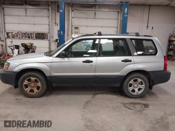 2004 Subaru Forester X with VIN JF1SG63644H712595, listed as a IAAI auction lot 43433108 with 141,984 mi miles and . Bid and sale history available at DreamBid. Image 12.