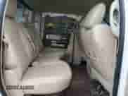 2014 Ram 1500 Laramie z VIN 1C6RR7NM4ES430439, wystawiony jako Copart lot #58587125 z przebiegiem Nie podano mil oraz Szkoda całkowita • Salvage title. Historia ofert i sprzedaży dostępna na DreamBid. Obrazek 11.