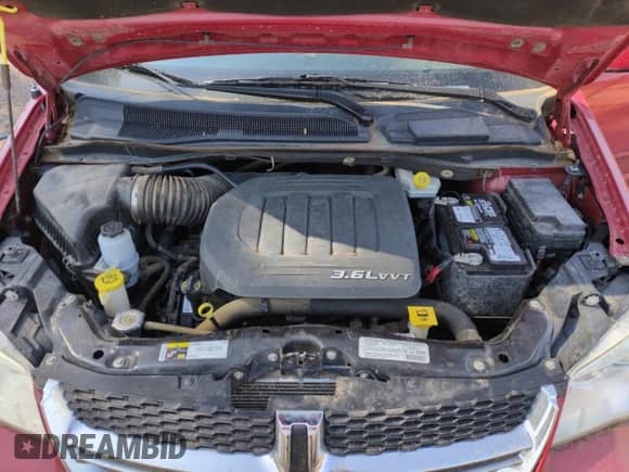 2013 Dodge Grand Caravan SXT with VIN 2C4RDGCGXDR633730, listed as a Copart auction lot 64557035 with 77,913 mi miles and Salvage title. Bid and sale history available at DreamBid. Image 12.