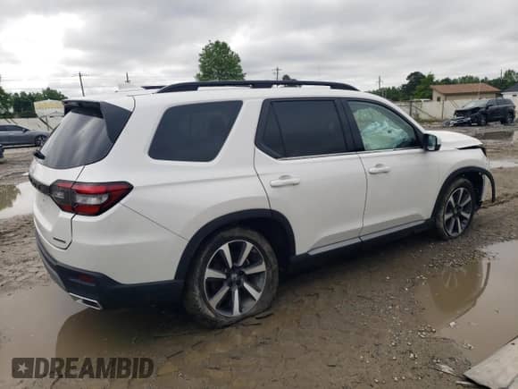 2023 Honda Pilot Touring z VIN 5FNYG1H75PB018012, wystawiony jako Copart lot #58642615 z przebiegiem 26 878 mil mil oraz Szkoda całkowita • Salvage title. Historia ofert i sprzedaży dostępna na DreamBid. Obrazek 3.