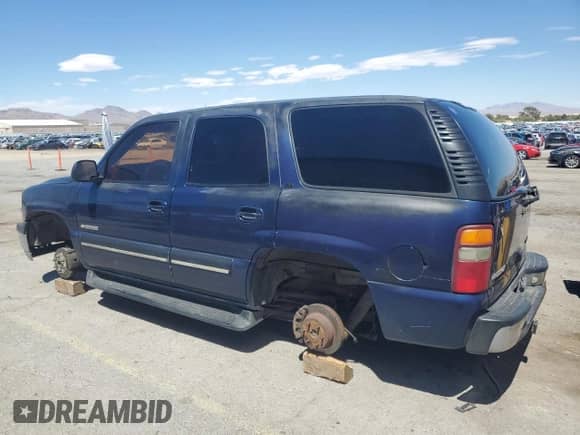 2001 Chevrolet Tahoe LS with VIN 1GNEC13T01R199886, listed as a Copart auction lot 64245125 with 242,201 mi miles and Salvage title. Bid and sale history available at DreamBid. Image 2.