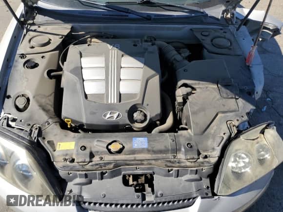 2003 Hyundai Tiburon GT z VIN KMHHN65F73U101856, wystawiony jako Copart lot #64248815 z przebiegiem 59 622 mil mil oraz Szkoda całkowita • Salvage title. Historia ofert i sprzedaży dostępna na DreamBid. Obrazek 11.