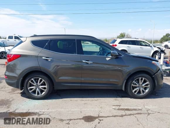 2014 Hyundai Santa Fe with VIN 5XYZU3LA4EG186807, listed as a IAAI auction lot 43393062 with 67,944 mi miles and . Bid and sale history available at DreamBid. Image 13.