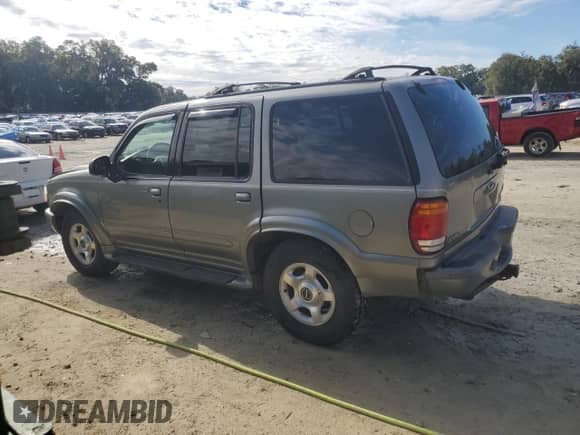 2000 Ford Explorer Limited with VIN 1FMDU75E9YUB50157, listed as a Copart auction lot 88743875 with 184,376 mi miles and Salvage title. Bid and sale history available at DreamBid. Image 2.