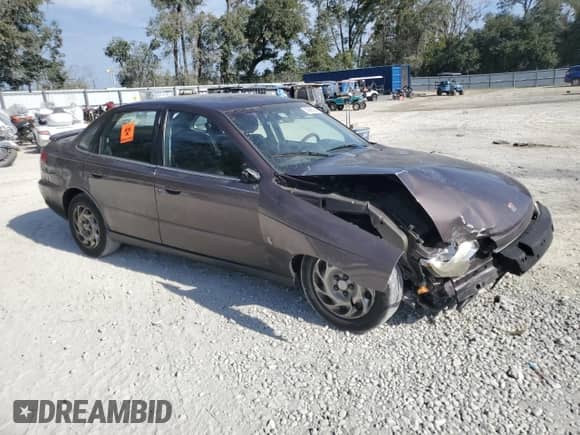 2000 Saturn LS with VIN 1G8JU52F3YY697730, listed as a Copart auction lot 83969324 with 176,491 mi miles and Salvage title. Bid and sale history available at DreamBid. Image 4.