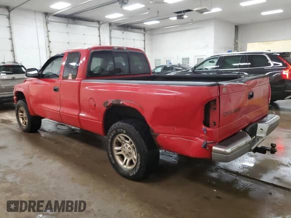 2003 Dodge Dakota с VIN 1D7HG42X23S296122, выставлен на аукционе Copart как лот 66366265 с пробегом 240 253 миль миль и Списание • Salvage title. История ставок и продаж доступна на DreamBid. Изображение 2.
