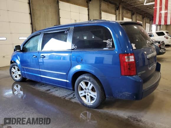 2010 Dodge Grand Caravan Crew with VIN 2D4RN6DX1AR455209, listed as a Copart auction lot 71793615 with 243,904 mi miles and Salvage title. Bid and sale history available at DreamBid. Image 2.