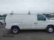 2009 Ford Econoline Cargo Commercial with VIN 1FTNE24W19DA72591, listed as a IAAI auction lot 42613439 with 239,038 mi miles and . Bid and sale history available at DreamBid. Image 6.