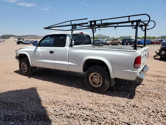 1999 Dodge Dakota SLT z VIN 1B7GG22Y7XS121079, wystawiony jako Copart lot #60632755 z przebiegiem 319 198 mil mil oraz Czysty tytuł • Clean title. Historia ofert i sprzedaży dostępna na DreamBid. Obrazek 2.