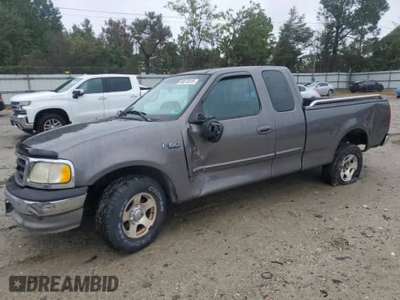2002 Ford F-150 XL with VIN 2FTRX17262CA17400, listed as a Copart auction lot 86613415 with 96,852 mi miles and Salvage title. Bid and sale history available at DreamBid. Image 1.