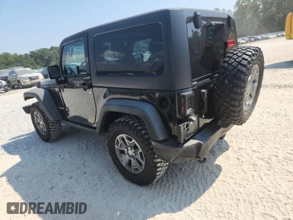 2015 Jeep Wrangler Rubicon Hard Rock z VIN 1C4BJWCG7FL662926, wystawiony jako Copart lot #80992525 z przebiegiem 63 734 mil mil oraz Szkoda całkowita • Salvage title. Historia ofert i sprzedaży dostępna na DreamBid. Obrazek 2.