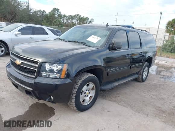 2010 Chevrolet Suburban LS z VIN 1GNUKHE38AR190423, wystawiony jako IAAI lot #41655080 z przebiegiem 215 187 mil mil oraz . Historia ofert i sprzedaży dostępna na DreamBid. Obrazek 2.