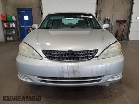 2004 Toyota Camry LE с VIN 4T1BE32K74U363867, выставлен на аукционе Copart как лот 80530065 с пробегом 217 036 миль миль и Списание • Salvage title. История ставок и продаж доступна на DreamBid. Изображение 5.