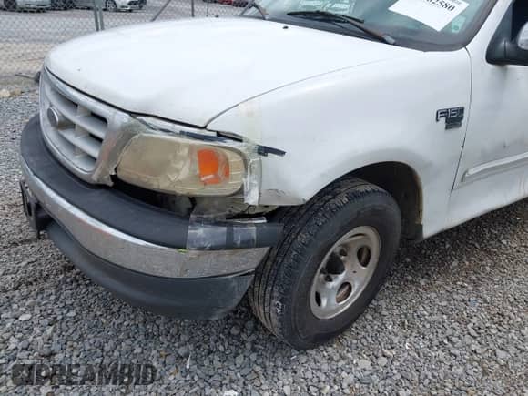 1999 Ford F-150 XL with VIN 1FTRX17L2XNB70799, listed as a IAAI auction lot 42762580 with Not provided miles and . Bid and sale history available at DreamBid. Image 6.