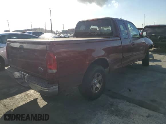 2003 Ford F-150 XL with VIN 1FTRX17W33NA89735, listed as a Copart auction lot 81902025 with 243,918 mi miles and Salvage title. Bid and sale history available at DreamBid. Image 3.