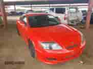 2005 Hyundai Tiburon GS z VIN KMHHM65DX5U156547, wystawiony jako IAAI lot #41786434 z przebiegiem 135 532 mil mil oraz . Historia ofert i sprzedaży dostępna na DreamBid. Obrazek 1.