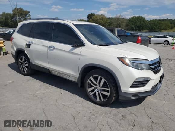 2017 Honda Pilot Touring with VIN 5FNYF6H91HB064701, listed as a Copart auction lot 81267865 with 209,701 mi miles and Salvage title. Bid and sale history available at DreamBid. Image 4.