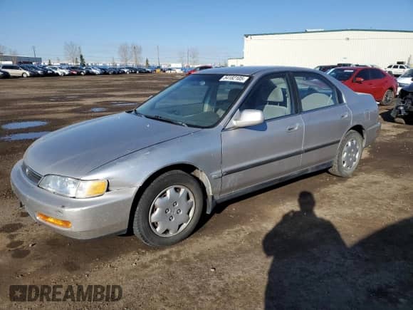 1997 Honda Accord LX with VIN 1HGCD5630VA809341, listed as a Copart auction lot 54182105 with 223,707 mi miles and Salvage title. Bid and sale history available at DreamBid. Image 1.