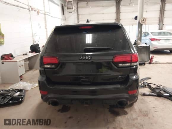 2015 Jeep Grand Cherokee SRT z VIN 1C4RJFDJ7FC663454, wystawiony jako IAAI lot #41482973 z przebiegiem 114 638 mil mil oraz . Historia ofert i sprzedaży dostępna na DreamBid. Obrazek 16.