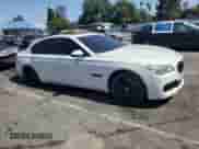 2013 BMW 7 Series 750i with VIN WBAYA8C54DC996412, listed as a Copart auction lot 56982895 with 124,258 mi miles and Salvage title. Bid and sale history available at DreamBid. Image 4.