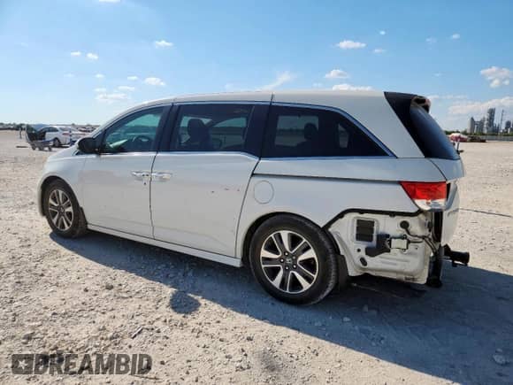 2015 Honda Odyssey Touring Elite с VIN 5FNRL5H98FB045583, выставлен на аукционе Copart как лот 82358465 с пробегом 139 649 миль миль и Списание • Salvage title. История ставок и продаж доступна на DreamBid. Изображение 2.