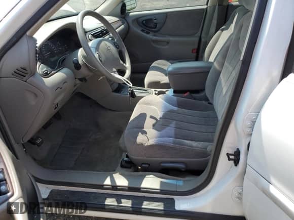 1998 Chevrolet Malibu LS z VIN 1G1NE52M8WY158738, wystawiony jako Copart lot #65030854 z przebiegiem 84 739 mil mil oraz Nie do naprawy • Non repairable. Historia ofert i sprzedaży dostępna na DreamBid. Obrazek 7.