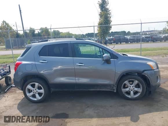 2015 Chevrolet Trax LTZ z VIN KL7CJTSB6FB188351, wystawiony jako IAAI lot #43161584 z przebiegiem 157 748 mil mil oraz . Historia ofert i sprzedaży dostępna na DreamBid. Obrazek 13.