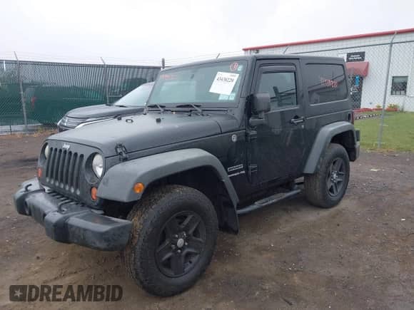 2012 Jeep Wrangler Sport with VIN 1C4AJWAG6CL179020, listed as a IAAI auction lot 43438220 with 153,792 mi miles and . Bid and sale history available at DreamBid. Image 2.