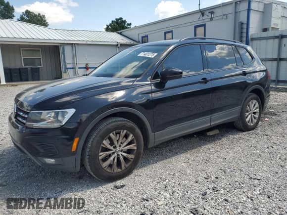 2018 Volkswagen Tiguan S с VIN 3VV1B7AX9JM015504, выставлен на аукционе Copart как лот 71401275 с пробегом 142 417 миль миль и Списание • Salvage title. История ставок и продаж доступна на DreamBid. Изображение 1.