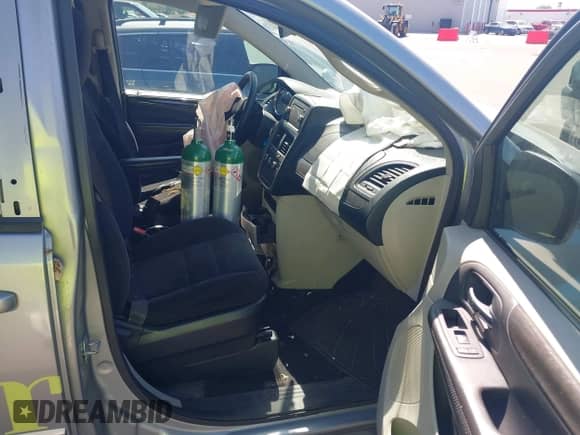 2014 Dodge Grand Caravan American Value with VIN 2C4RDGBG9ER378216, listed as a IAAI auction lot 43112588 with Not provided miles and . Bid and sale history available at DreamBid. Image 5.