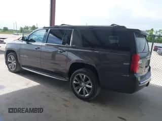 2015 Chevrolet Suburban LTZ z VIN 1GNSCKKCXFR627304, wystawiony jako IAAI lot #42826425 z przebiegiem 137 294 mil mil oraz . Historia ofert i sprzedaży dostępna na DreamBid. Obrazek 3.