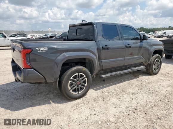 2024 Toyota Tacoma SR5 with VIN 3TMLB5JN1RM024042, listed as a Copart auction lot 70640855 with 23,853 mi miles and Salvage title. Bid and sale history available at DreamBid. Image 3.